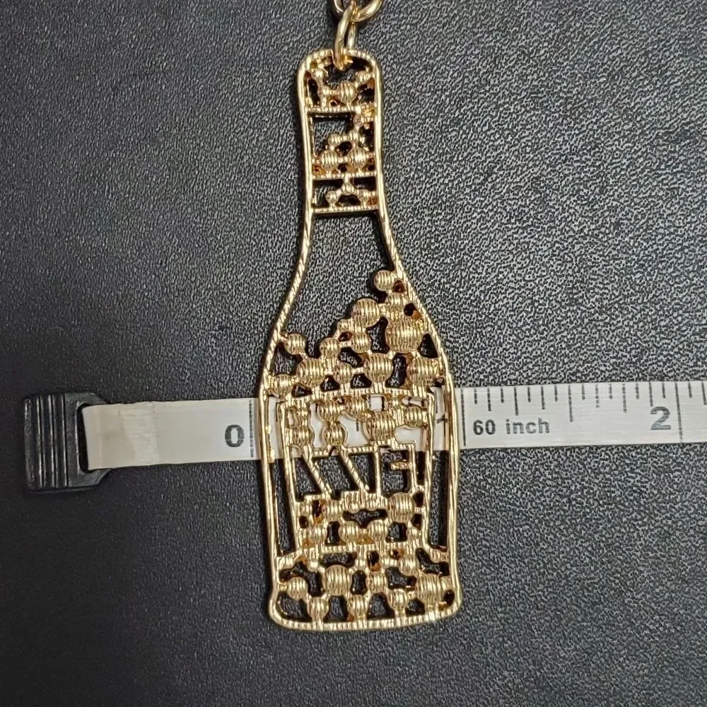 Gold tone Fizz bottle keychain